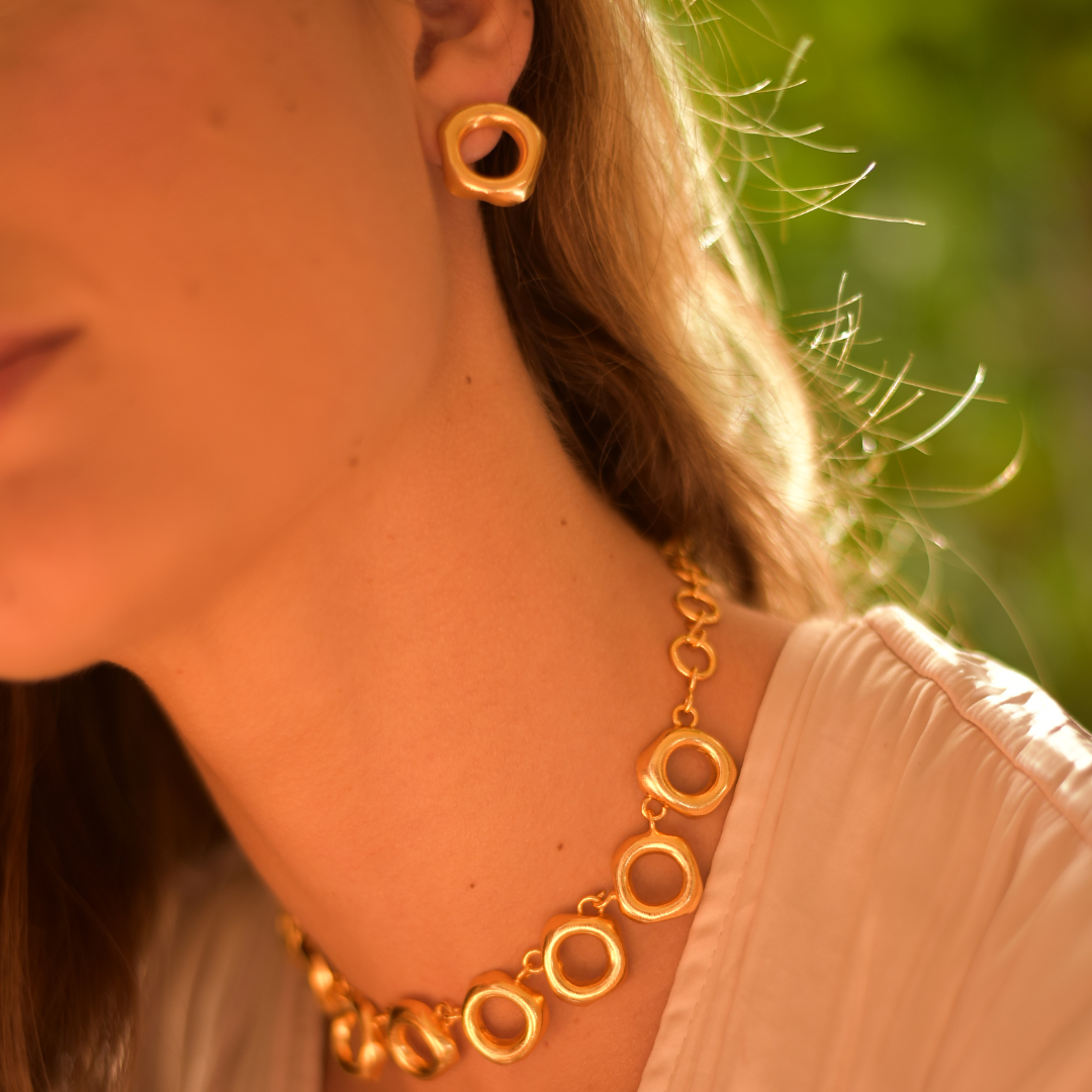 Handcrafted Topir Earrings in bronze with a 24-karat gold plating.