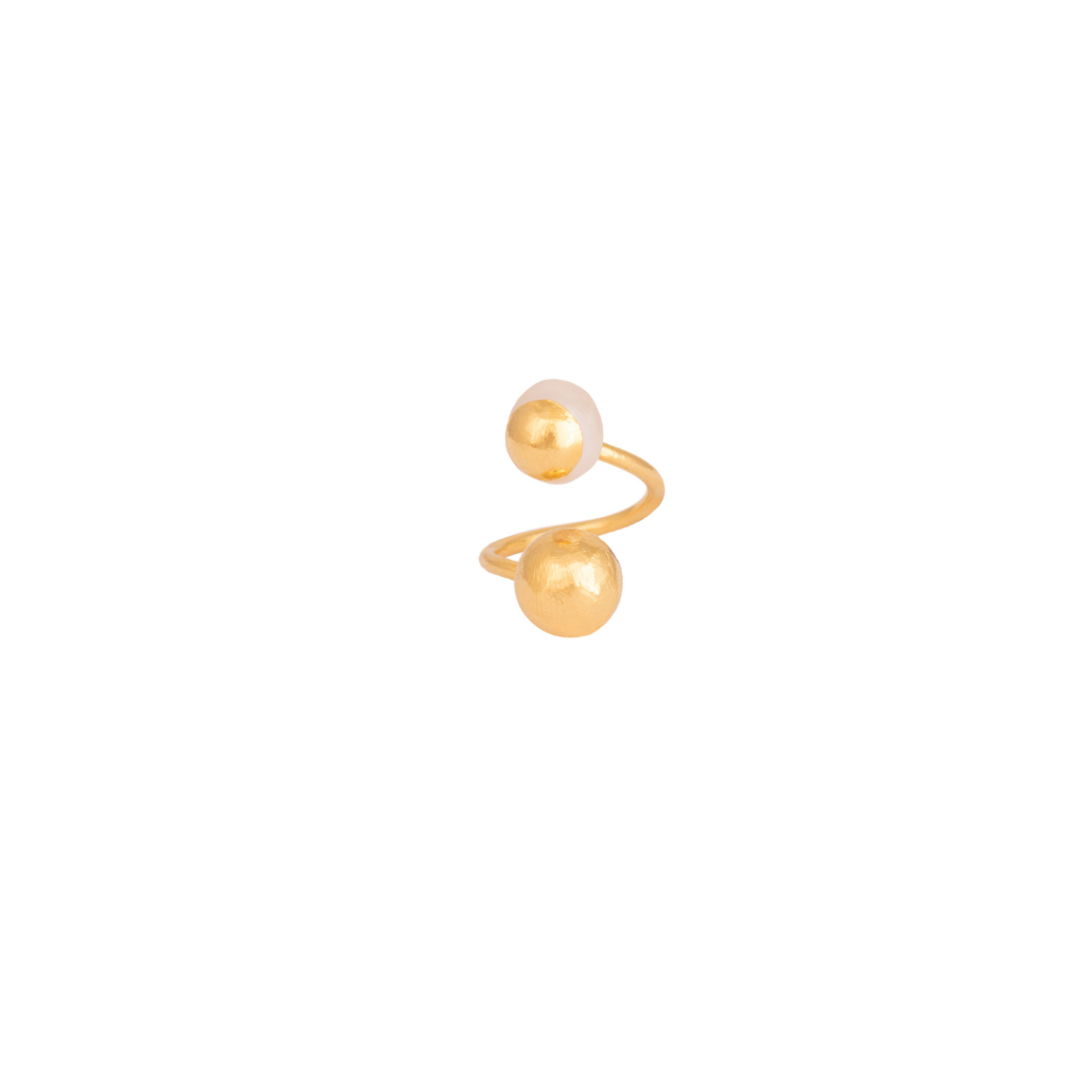 The Bambi ring is handmade by Colombian artisans in bronze with 24-karat gold plating and cultured pearl