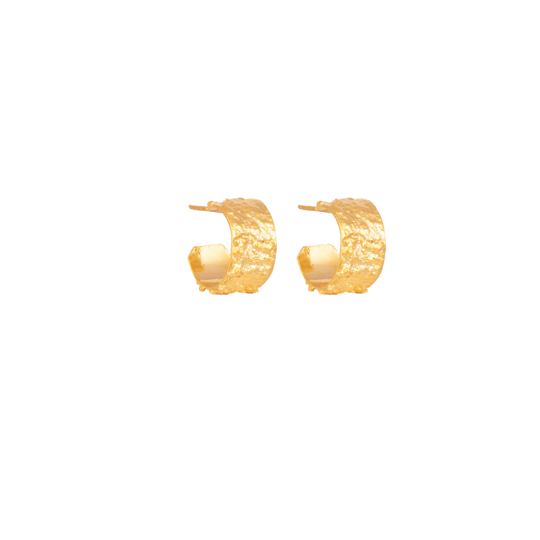 The Kokina Mini Hoop earrings are handmade by Colombian artisans in bronze with 24-karat gold plating.