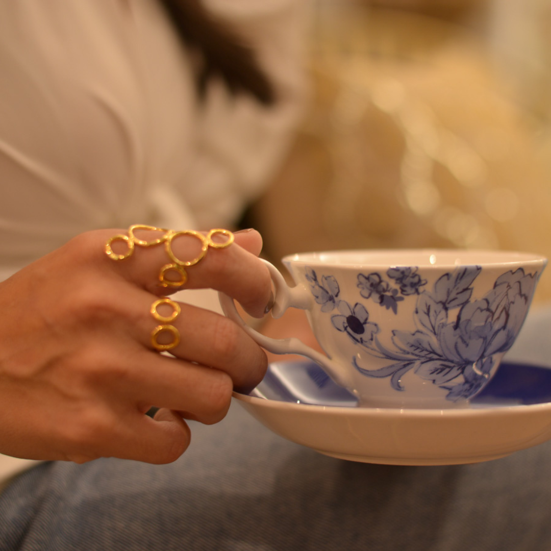 The Atomo Ring handmade by Colombian artisans in bronze with 24-karat gold plating